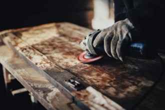 An angle grinder in motion on wood, highlighting the grain and texture