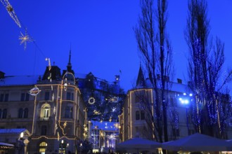 The Three Bridges over the Ljubljanica River, Ljubljana Castle at dusk at Christmas time, Ljubljana