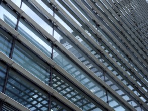 A full frame modern office architecture abstract with geometric shapes and buildings reflected in
