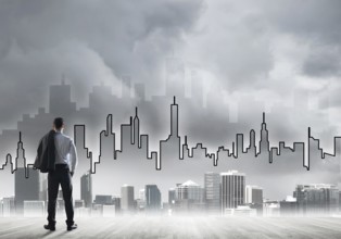 Motivation and inspiration concept with modern cityscape and businessman observing it