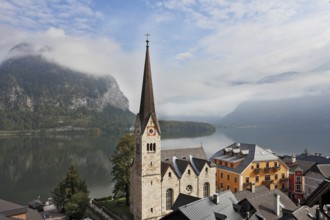 The most picturesque small town in Austria - Hallstatt. Slender belfry and Lutheran church on the