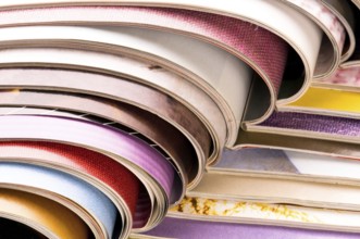 Stack of open magazines