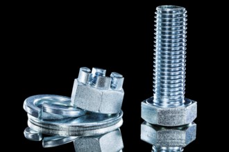 Set of crown nuts screwbolt spring washer on black background