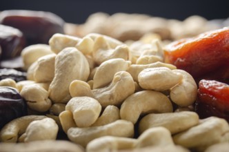 Closeup view at cashew nuts on kitchen table. Vegetarian food concept