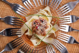 Presentation first dish of pappardelle with meat sauce and tomato