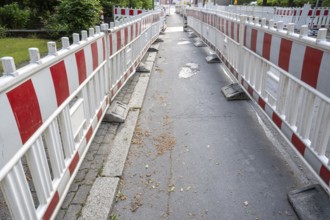Construction site barrier of a road with a sidewalk