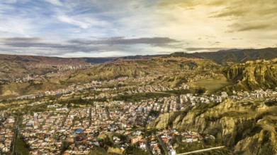 La Paz, Bolivia, aerial view flying over the dense, urban cityscape. San Miguel, southern distric.