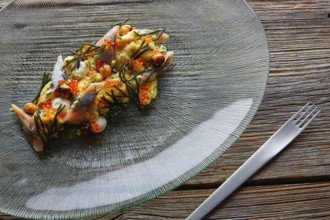 Smoked sardines salad with creamy cheese corn codium and hazelnuts