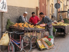Taroudant, Morocco, 21 March, 2024: greengrocer selling fruit from his pushcart in the streets of