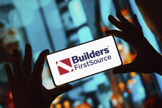 In this photo illustration, the Builders FirstSource logo is displayed on a smartphone screen