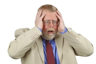 Desperate man holding both hands to his head. White background
