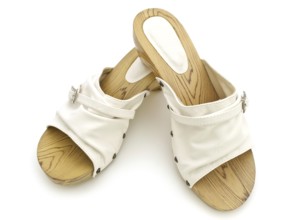 Woman summer white shoes over white background