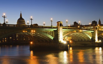 Illuminated Southwark Bridge at the blue hour, London, England London, England
