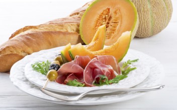 Ham with melon and olives