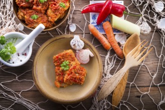 Fish in Greek kind with vegetables and tomato sauce