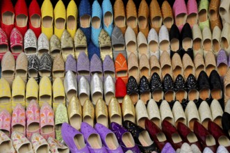 Meknes, Morocco, Africa, Colourful shoes in a variety of colours and patterns on display, On the