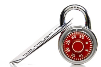 A set of credit cards secured with a padlock