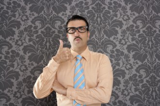 Nerd businessman gesturing ok positive with hand over retro wallpaper