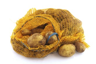 Plastic bag full potatoes isolated over white background