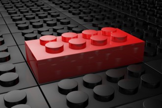 3D rendering red toy bricks standing out from crowd of black toy bricks . Leadership, independence,