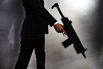 Businessman to fight with a machine gun. Shooting Location: Yokohama-city kanagawa prefecture