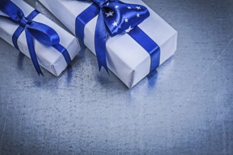 Collection of packed present boxes on metallic background celebrations concept