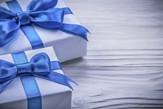 Present boxes on wooden board horizontal view celebrations concept