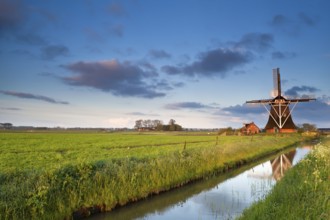 Charming Dutch windmill at sunrise, Groningen, Netherlands