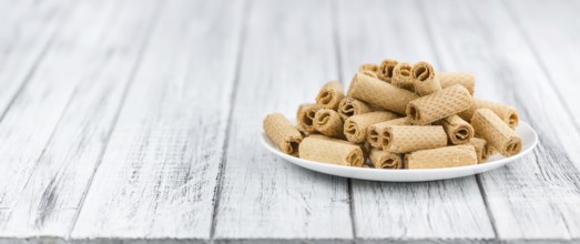 Sweet Wafers as high detailed close-up shot on a vintage wooden table, selective focus