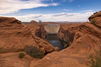 Blue skies over the dam letting water go providing energy on the Colorado River near Page Arizona