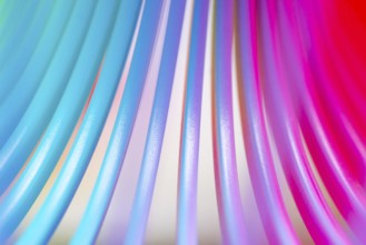 Details of a rainbow coloured plastic toy
