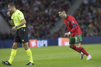 Football match, referee Donatas RUMSAS LTU left whistles for a free kick, captain Cristiano RONALDO