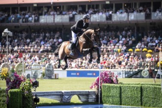 Richard Vogel of Germany and riding United Touch S compete in the first round of the 1.60m CPKC