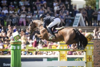 Max Kuhner of Austria riding Elektric Blue P compete in the first round of the 1.60m CPKC