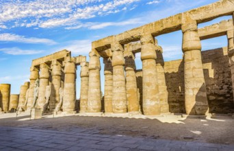 Colonnade in Karnak Temple and blue cloudy sky, Luxor