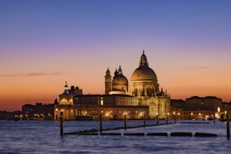 Santa Maria della Salute (Saint Mary of Health) at sunset time, a Catholic church in Venice, Italy,