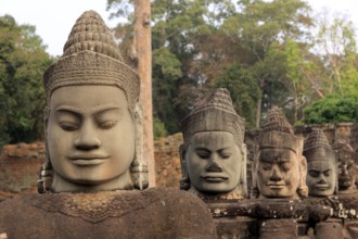 Balustrade with stone gods and demons on the bridge to the southern Tor tor of Angkor Thom