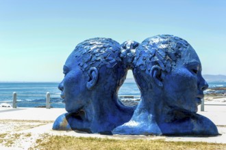 Blue heads statue in Cape Town. Art of south Africa. Sea Point promenade