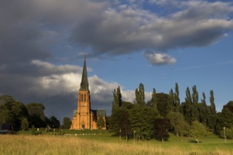 Undenas church in the Swedish village Undenas lights up in the last rays of sunlight