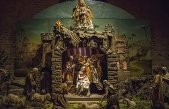 Traditional Christmas nativity scene with beautiful figures made out of wood. The birth of Jesus