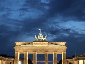 Impressive evening shot of the illuminated Brandenburg Tor against a dark sky, Berlin, Germany,