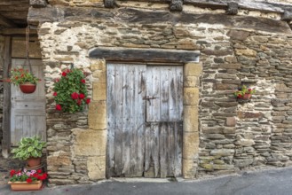 Old wall of a house in the village of Estaing. Aveyron. France