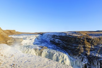 Gullfoss waterfall with ice, Hvítá river, Haukadalur, Golden Circle, South Iceland, Iceland, Europe