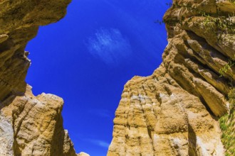 Scenic Clay Cliffs. Bright blue sky above the tops of picturesque rocks. Travel to New Zealand. The
