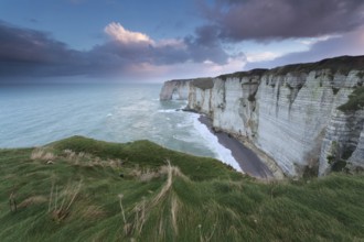 Calm marine sunrise over cliffs in ocean, Normandy, France, Europe