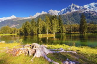The mountain resort of Chamonix, Haute-Savoie. City Park is illuminated by sunset. The lake