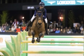 Jessica Burke of Ireland competes in the equestrian Audi Grand Prix at Jumping International