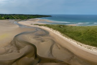 A panorama drone landscape view of the beautiful golden sand beach at Lacken Strand on the coast of