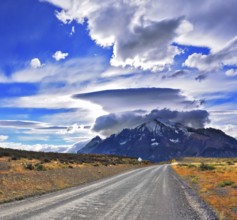 Stunning sunset in the Chilean Patagonia. Incredible clouds over the mountain glaciers. The dirt