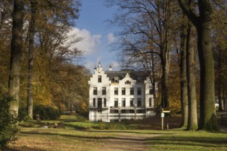 Castle Staverden near Ermelo in the Dutch region Veluwe seen from the surrounding autumn mooded